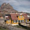 Old buildings and the heart shaped mountain in Uummannaq