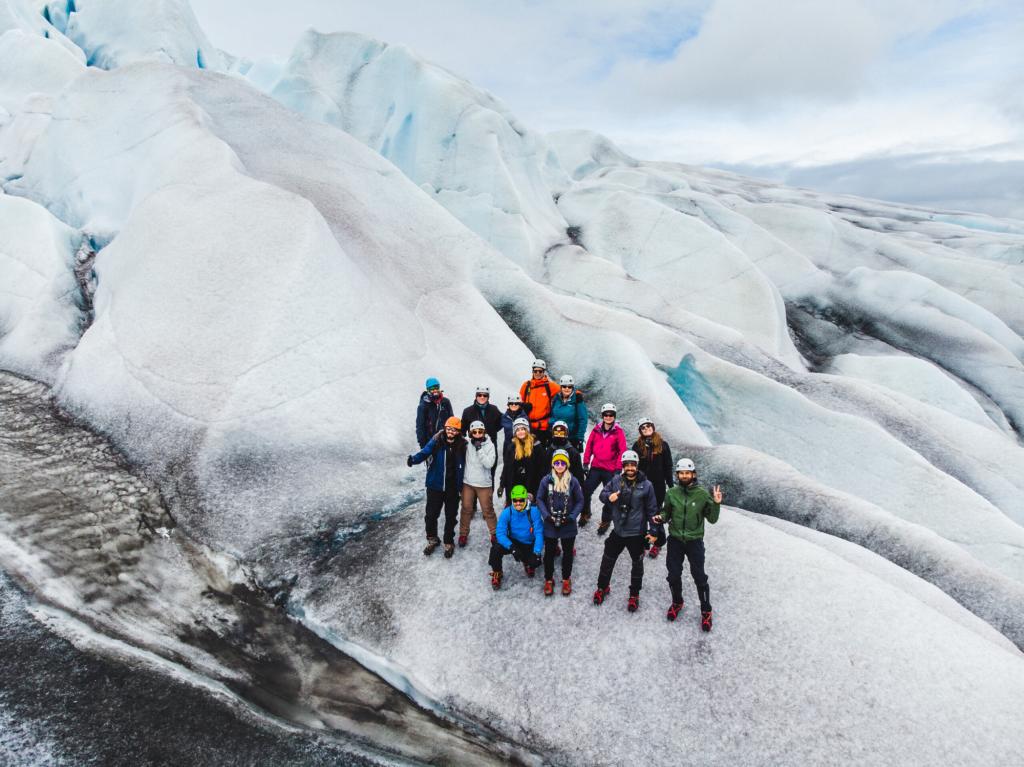 Hiking group on the ancient glacier ice in South Greenland