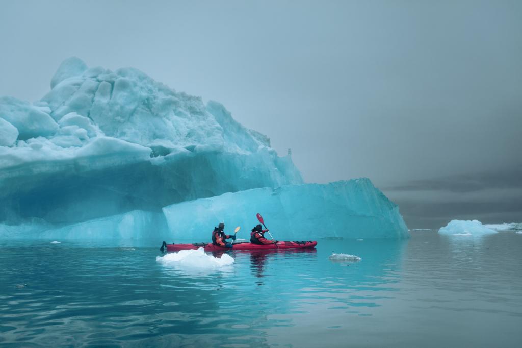 Kayaking among spectacular ice formations in Tasiusaq Bay