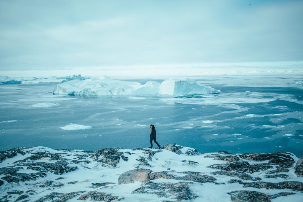 Walking near Ilulissat Icefjord with views over Disko Island and Disko Bay