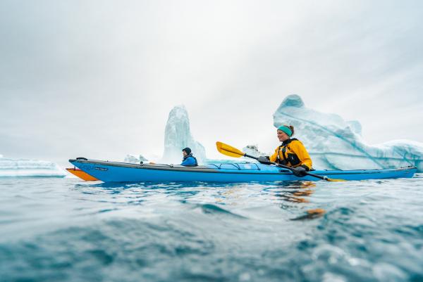 Kayaking between icebergs close to Qeqertarsuaq 