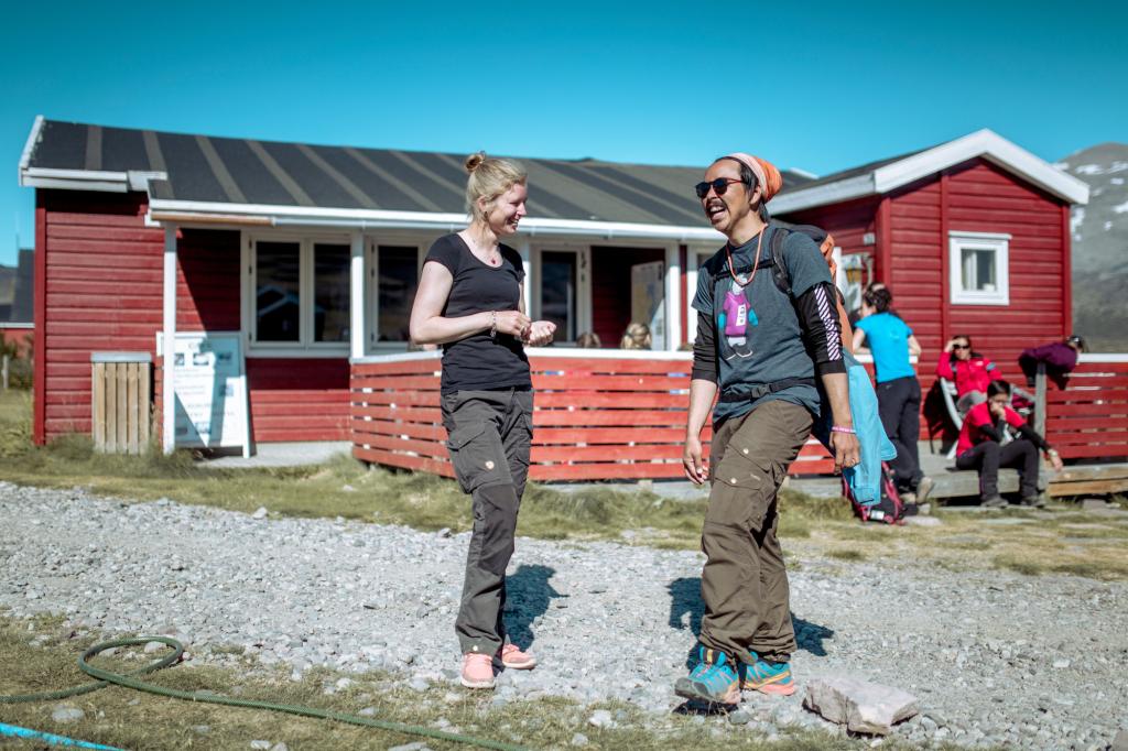 Guests enjoying a conversation outside Igaliku Country Hotel in South Greenland