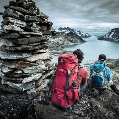 Two hikers overlooking Ikaasatsivaq sound in East Greenland near Tiniteqilaaq